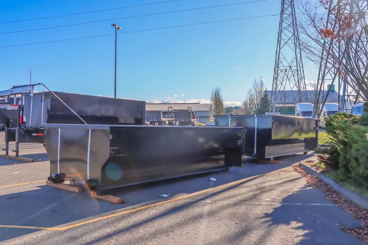 Roll-off dumpster ready for waste disposal at job site for Concrete Dumpster Rental in Ormond-by-the-Sea